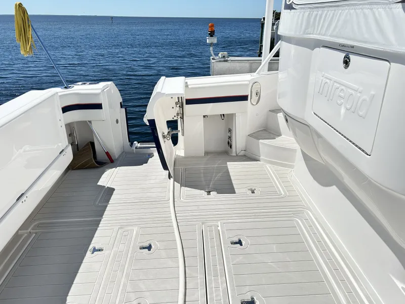 Slide: The Image of Intrepid 475 Sport Yacht 2018, spacious deck by the sea. - 15