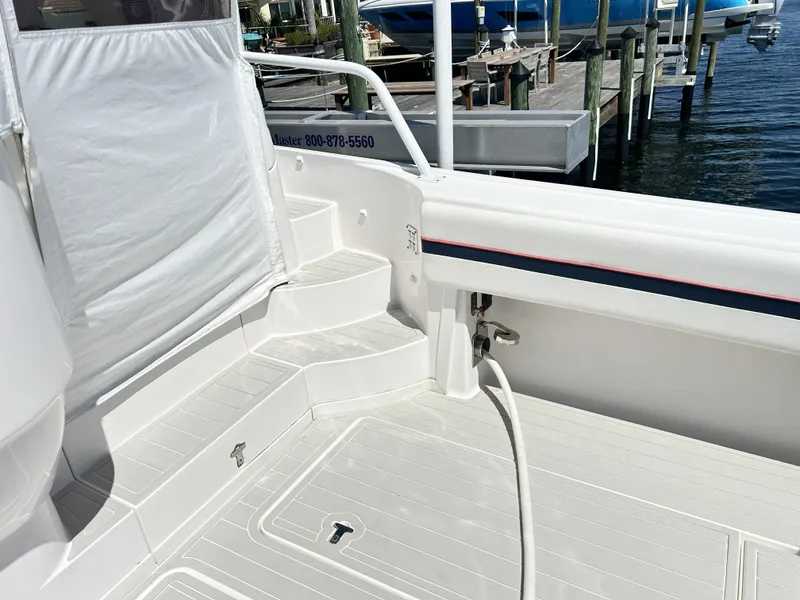 Slide: The Image of Intrepid 475 Sport Yacht 2018, white deck area with steps and railing. - 18