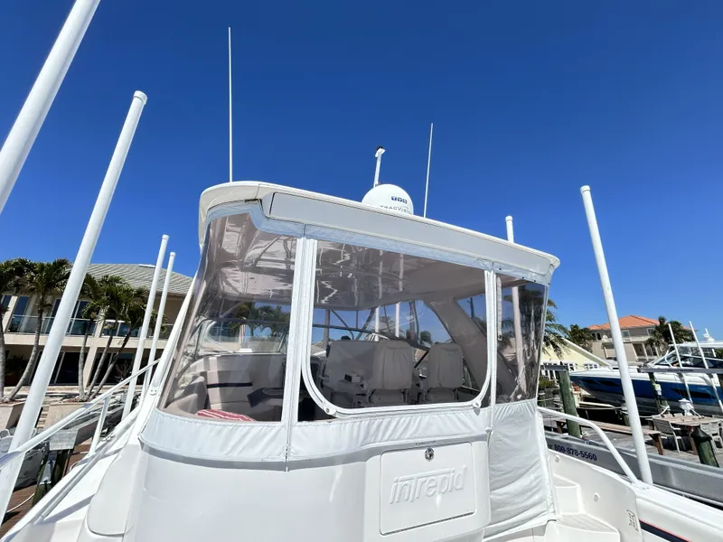 Slide: The Image of 2018 Intrepid 475 Sport Yacht docked under clear blue sky. - 26