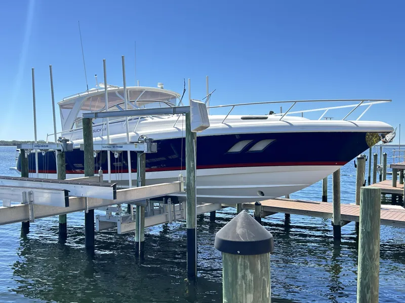 Slide: The Image of 2018 Intrepid 475 Sport Yacht on a boat lift at the dock. - 3