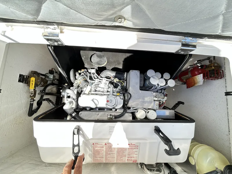 Slide: The Image of Engine compartment of 2018 Intrepid 475 Sport Yacht with fire extinguisher. - 30