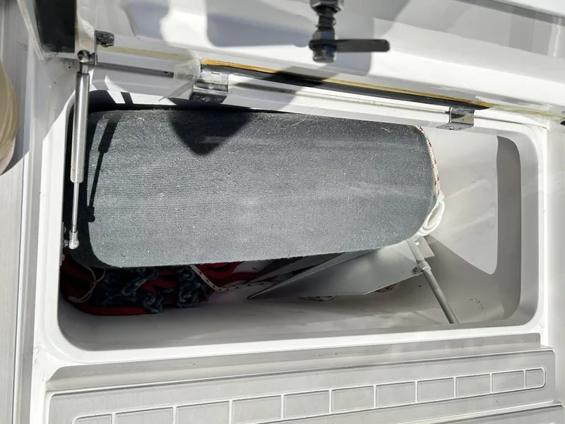 Slide: The Image of Storage compartment in 2018 Intrepid 475 Sport Yacht with equipment. - 35