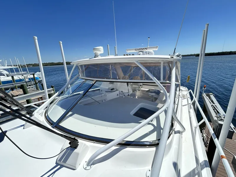 Slide: The Image of Intrepid 475 Sport Yacht 2018 at dock, clear sky. - 44