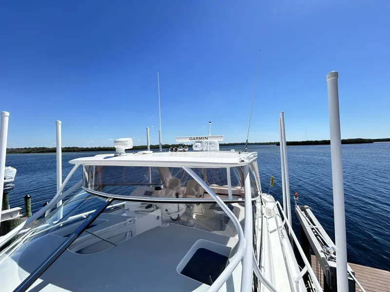 Slide: The Image of 2018 Intrepid 475 Sport Yacht docked under clear blue sky. - 45