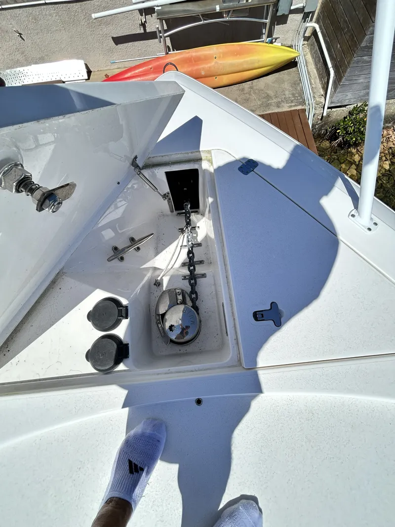 Slide: The Image of Intrepid 475 Sport Yacht 2018 anchor compartment with chain and fittings. - 46