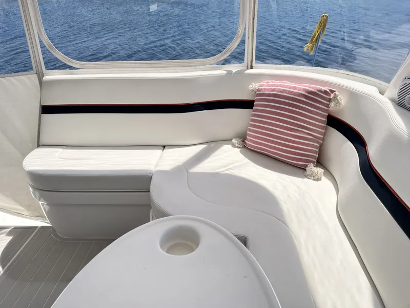 Slide: The Image of Intrepid 475 Sport Yacht 2018, luxurious seating area with cushion. - 49