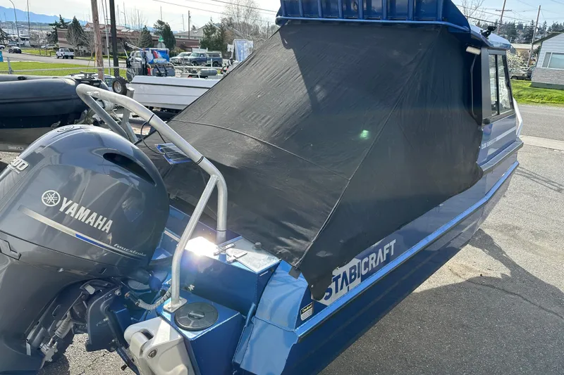 Slide: The Image of 2017 Stabicraft 2100 Supercab with Yamaha outboard motor, parked outdoors. - 16
