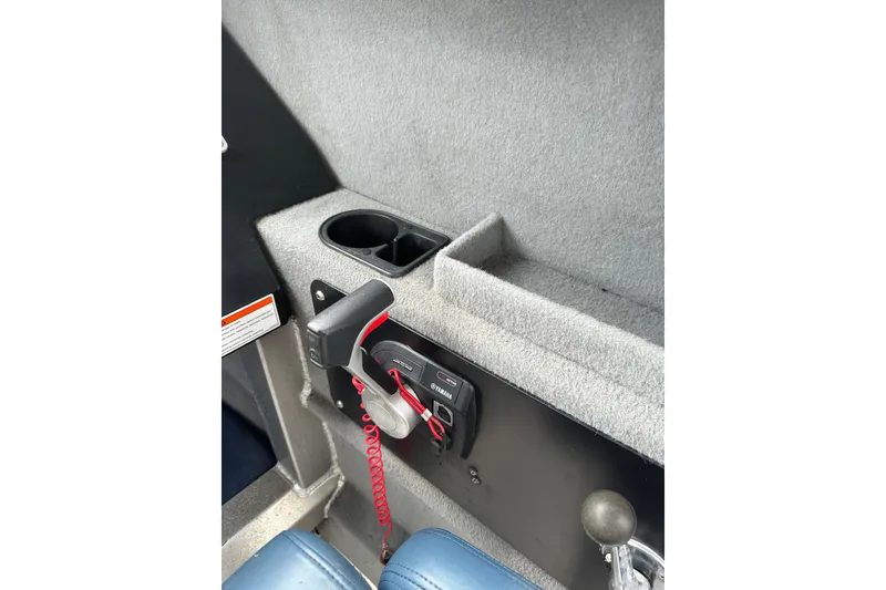 Slide: The Image of Interior of 2017 Stabicraft 2100 Supercab showing control panel and cup holder. - 21