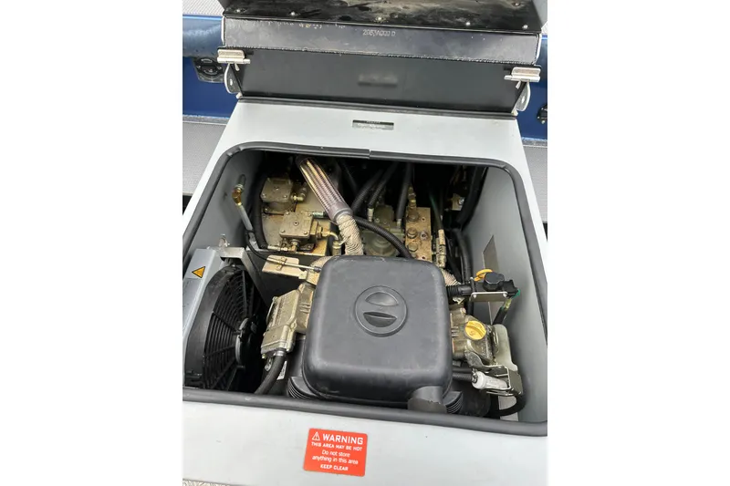 Slide: The Image of Engine compartment of a 2017 Stabicraft 2100 Supercab boat, showcasing mechanical components. - 22