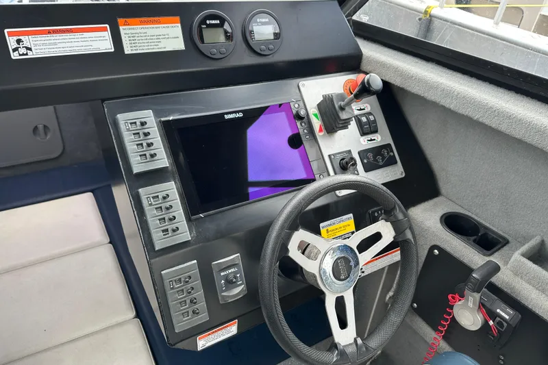 Slide: The Image of Control panel of a 2017 Stabicraft 2100 Supercab with steering wheel and navigation system. - 6