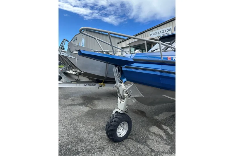 Slide: The Image of 2017 Stabicraft 2100 Supercab boat on trailer, blue exterior, parked outdoors. - 9