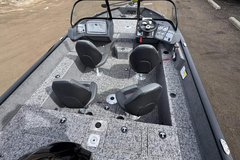 Slide: The Image of 2025 Tracker Pro Guide V-175 WT boat interior with four seats and control panel. - 6
