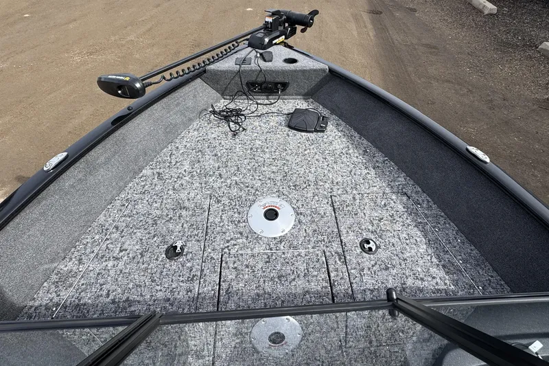 Slide: The Image of 2025 Tracker Pro Guide V-175 WT boat deck with trolling motor and storage compartments. - 7