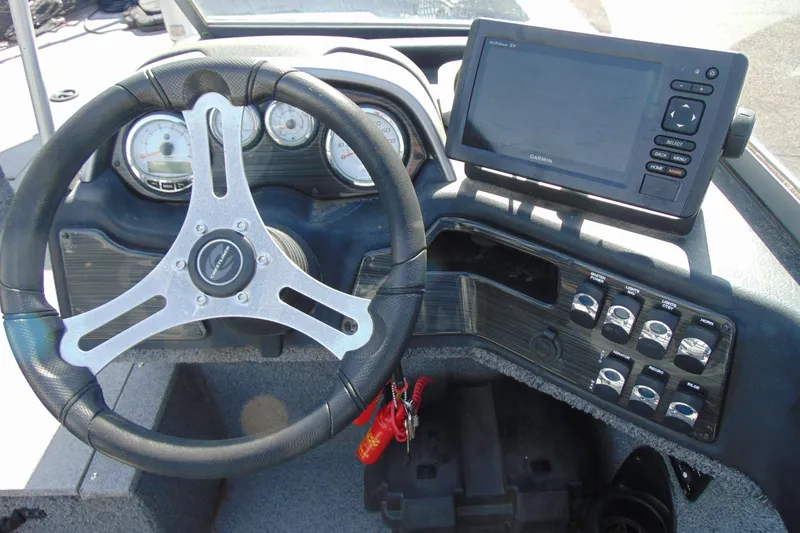 Slide: The Image of 2018 Crestliner 1850 Raptor WT dashboard with steering wheel and Garmin GPS system. - 10