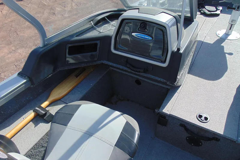 Slide: The Image of Interior of 2018 Crestliner 1850 Raptor WT boat with seating and storage. - 12