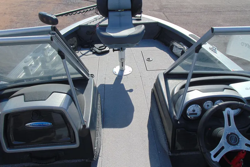 Slide: The Image of 2018 Crestliner 1850 Raptor WT boat interior with steering wheel and seating. - 13