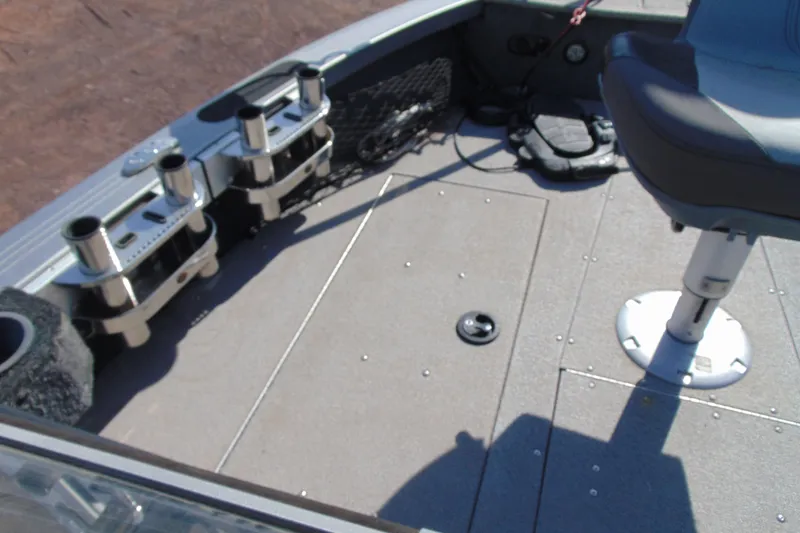 Slide: The Image of 2018 Crestliner 1850 Raptor WT boat interior with rod holders and seating. - 15