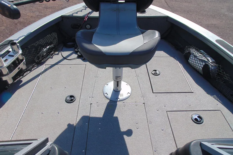 Slide: The Image of 2018 Crestliner 1850 Raptor WT boat interior with seating and storage compartments. - 16