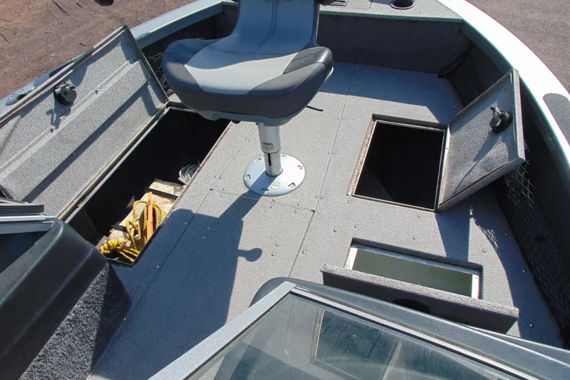 Slide: The Image of 2018 Crestliner 1850 Raptor WT boat interior with storage compartments and swivel seat. - 18