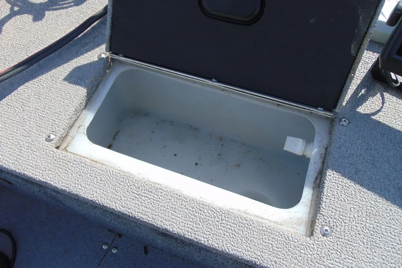 Slide: The Image of Open storage compartment on 2018 Crestliner 1850 Raptor WT boat. - 19