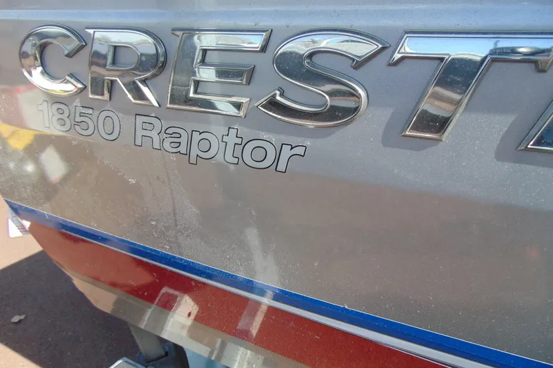 Slide: The Image of 2018 Crestliner 1850 Raptor WT boat logo on metallic surface. - 4