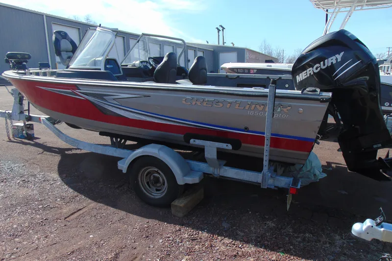 Slide: The Image of 2018 Crestliner 1850 Raptor WT boat on trailer with Mercury outboard motor. - 6