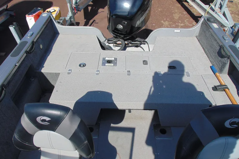 Slide: The Image of 2018 Crestliner 1850 Raptor WT boat interior with seating and storage compartments. - 7