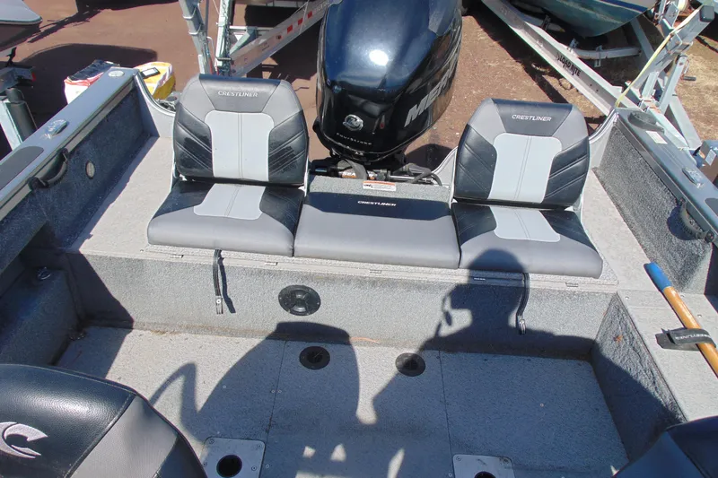 Slide: The Image of 2018 Crestliner 1850 Raptor WT boat interior with seating and motor. - 8