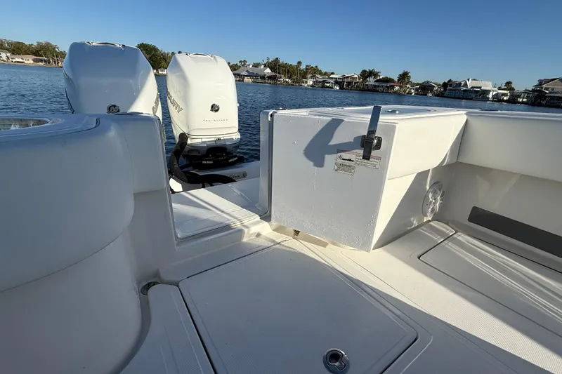 Slide: The Image of 2020 Sea Hunter 31 Tournament boat with twin Mercury engines on a sunny day. - 10