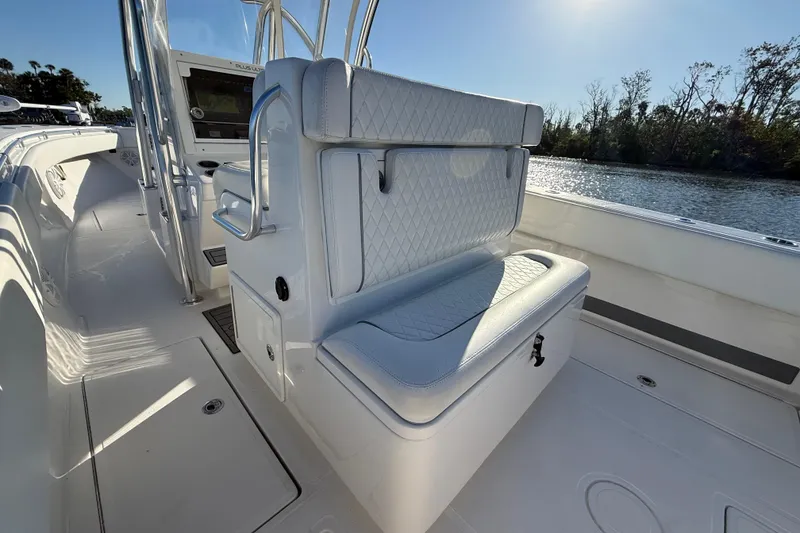 Slide: The Image of 2020 Sea Hunter 31 Tournament boat interior with cushioned seating and water view. - 13