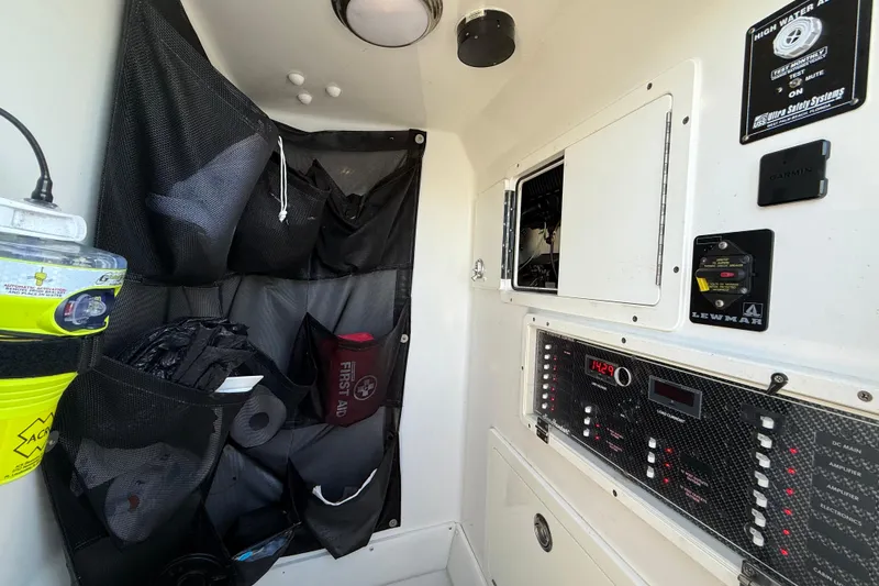 Slide: The Image of Interior of 2020 Sea Hunter 31 Tournament boat with storage and control panels. - 17