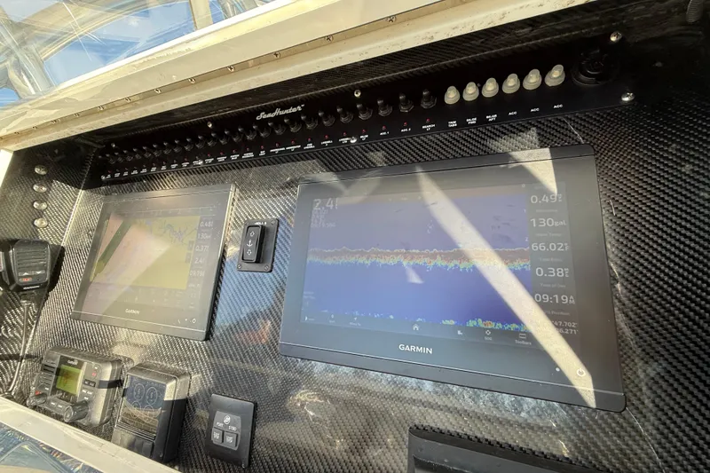 Slide: The Image of Control panel of 2020 Sea Hunter 31 Tournament boat with Garmin displays. - 18