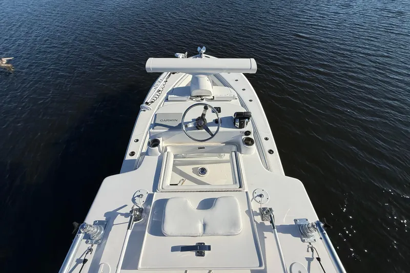 Slide: The Image of 2020 Sea Hunter 31 Tournament boat on calm water, featuring Garmin navigation. - 20