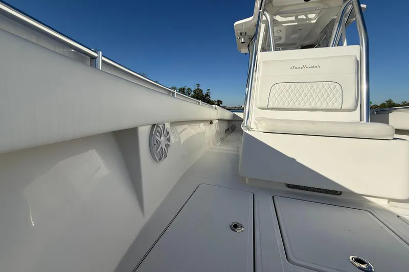 Slide: The Image of 2020 Sea Hunter 31 Tournament boat interior with sleek white design and seating. - 26