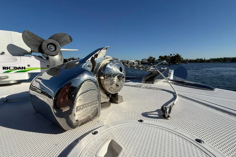 Slide: The Image of 2020 Sea Hunter 31 Tournament boat deck with anchor and motor, on a sunny day. - 29