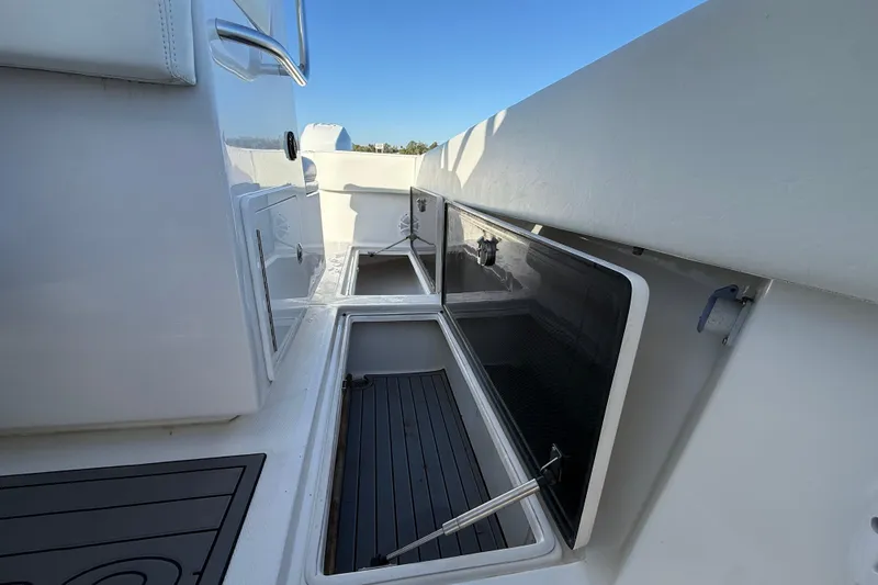 Slide: The Image of 2020 Sea Hunter 31 Tournament boat interior with open storage compartments. - 32