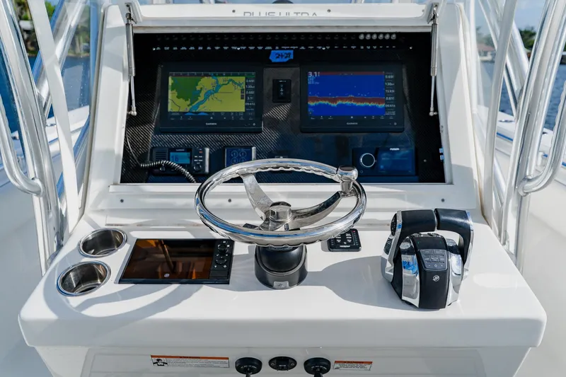 Slide: The Image of Helm of 2020 SeaHunter 31 Tournament boat with navigation screens and controls. - 36