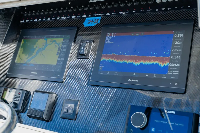 Slide: The Image of Dashboard of a 2020 SeaHunter 31 Tournament with Garmin navigation displays. - 37