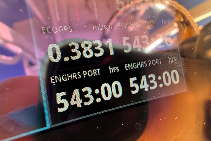 Slide: The Image of Close-up of Sea Hunter 31 Tournament 2020 boat dashboard displaying engine hours and fuel efficiency. - 38