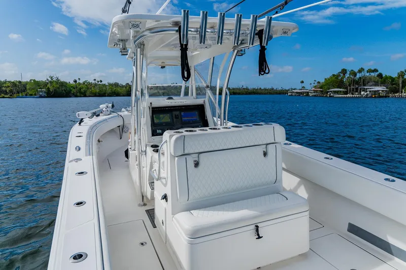 Slide: The Image of 2020 SeaHunter 31 Tournament boat on calm water, featuring sleek design and advanced navigation equipment. - 39