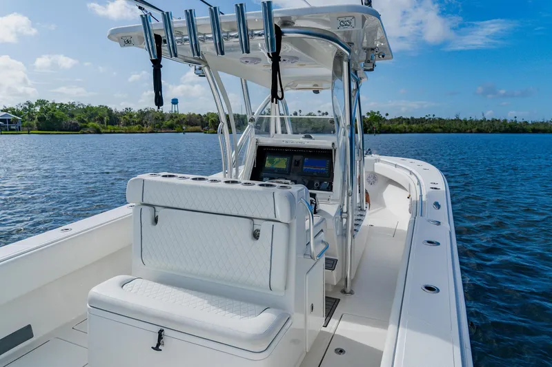 Slide: The Image of 2020 SeaHunter 31 Tournament boat on calm water, featuring modern navigation equipment. - 40