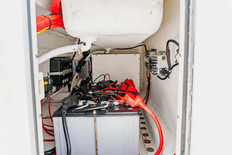 Slide: The Image of Battery compartment of a 2020 SeaHunter 31 Tournament boat with wiring and connections. - 45
