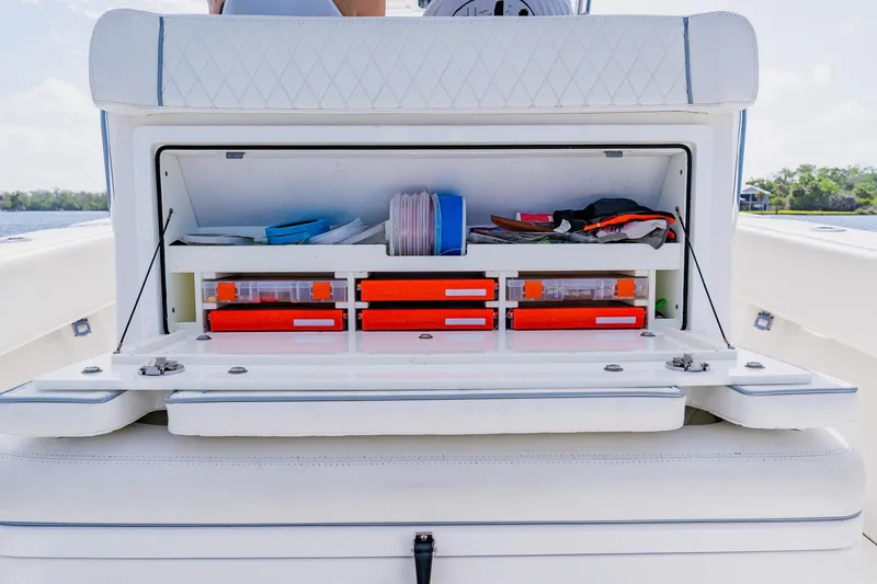 Slide: The Image of Storage compartment on a 2020 SeaHunter 31 Tournament boat, organized with fishing gear. - 46