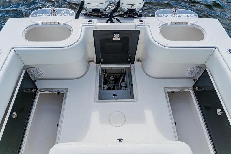 Slide: The Image of 2020 SeaHunter 31 Tournament boat deck with storage compartments and live wells. - 51