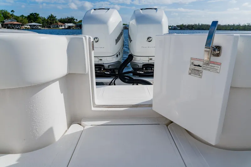 Slide: The Image of 2020 SeaHunter 31 Tournament boat with twin Mercury outboard engines on a sunny day. - 53