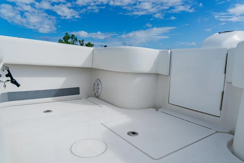 Slide: The Image of 2020 SeaHunter 31 Tournament boat deck with storage compartments under a clear blue sky. - 54