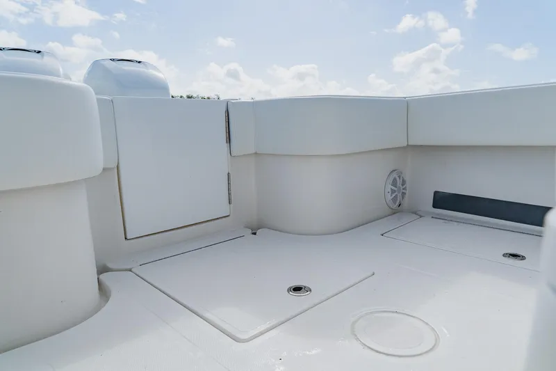 Slide: The Image of 2020 SeaHunter 31 Tournament boat deck with storage compartments and seating. - 55