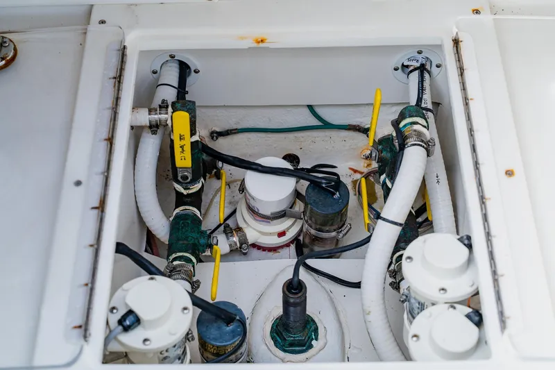 Slide: The Image of Bilge compartment of 2020 SeaHunter 31 Tournament boat with hoses and valves. - 59