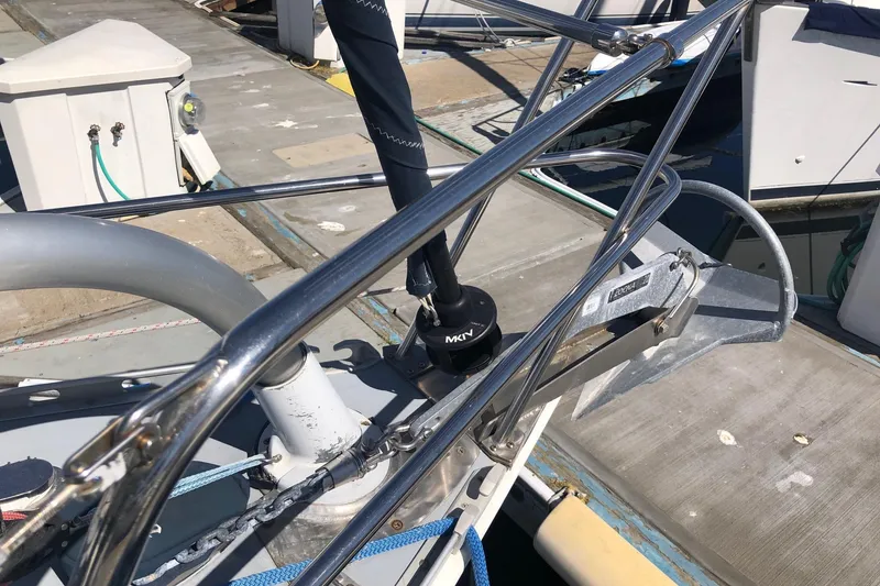 Slide: The Image of Deck of a 1988 Freedom 36 sailboat with anchor and railing details. - 2