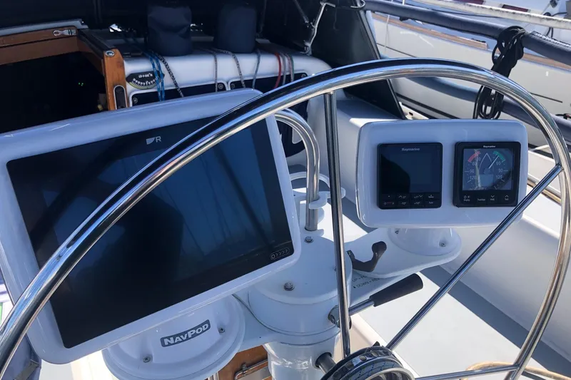 Slide: The Image of Cockpit of 1988 Freedom 36 sailboat with navigation instruments and steering wheel. - 3